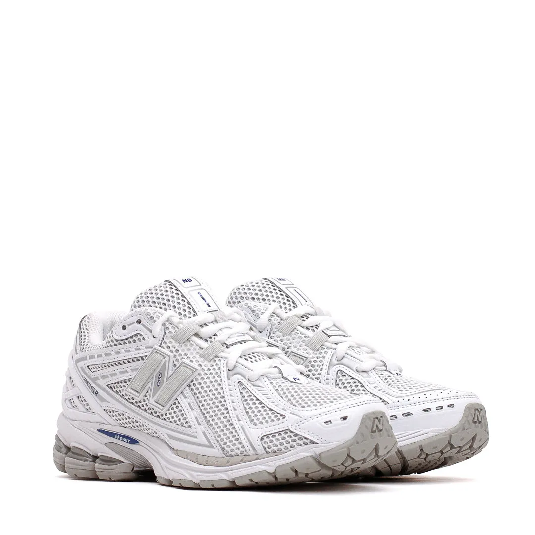 New Balance Unisex 1906R White U1906RCA multi - surface running shoes running in a softball field area shoes